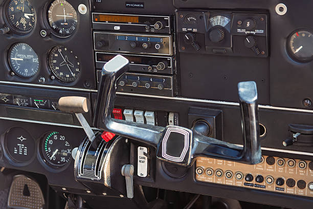 dashboard cockpit plane gauges and dials , inside a small airplane, controls to fly