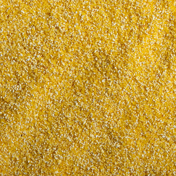 Raw Yellow Corn Grits Close-Up Texture stock photo
