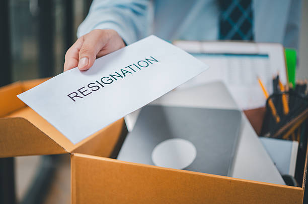 istock Hand holding a resignation envelope After resigning from work to find a new job , was fired by the company or when the employment contract expires, resulting in being unemployed 2232857078