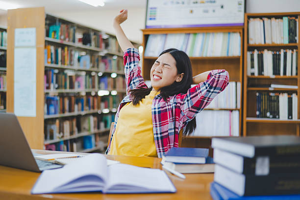 istock Students are relaxing after working on their laptops and searching for books to study, make reports, find useful information in the university room. 2232857348