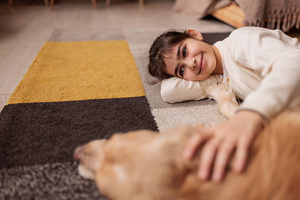 istock Childhood friendship with pet dog 2232857512