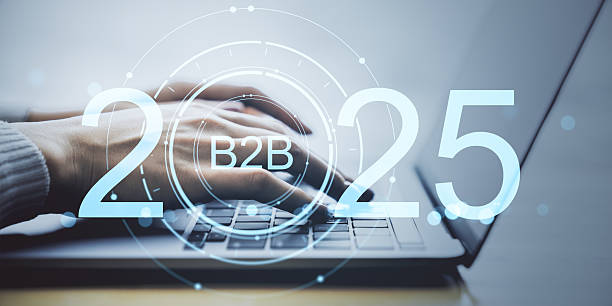 istock B2B marketing and sales digital transformation for 2025 shown through futuristic interface over laptop keyboard with hands typing on desk surface. 2232857522