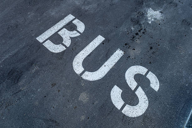 istock The gray pavement features bold white lettering indicating a designated bus parking area, highlighting urban transit organization 2232857917