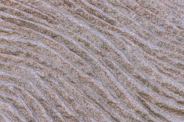 istock View of weathered, densely packed rock formations in a textured rocky terrain, under soft, even lighting No visible sky a 2232861969