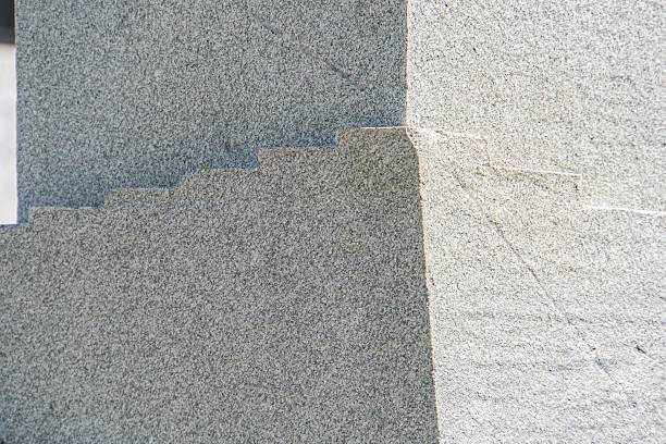 istock Close-up view of irregular, gray stone stairs in a modern urban setting, under soft diffused lighting No additional details or context provided 2232862139