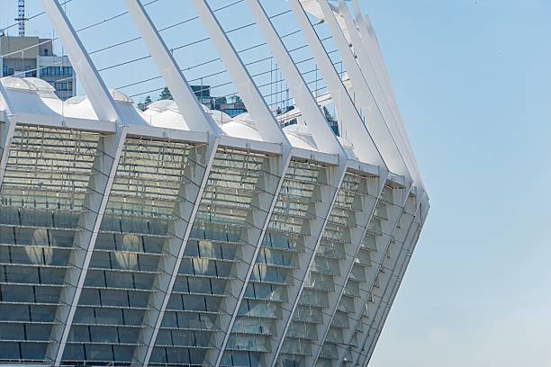 istock Modern urban architecture, white beams grid pattern, monochromatic color scheme, overcast lighting, ground level perspective, open sky background, architectural photography style, no people, balanced 2232862427