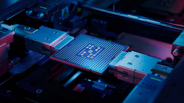 istock Computer Chip illuminated with Blue Light in Industrial Environment. Microchip on Conveyor Line during Production and Packaging Process on Semiconductor Fab. Processor at Engineering Laboratory 2232863800