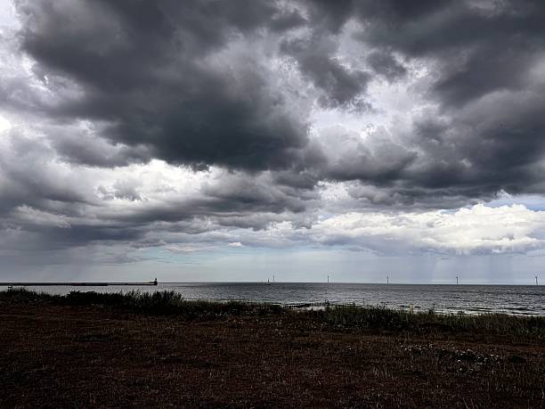 Dramatic moody clouds over the Northumberland coast at Blyth