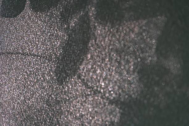 istock Close-up of a metallic object with rough texture under harsh, uneven lighting, featuring scattered particles Ambiguous purpose or identity Muted color palette Shallow perspective and undefined edg 2232867083