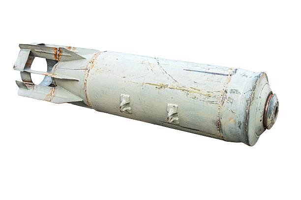 istock Aged, cylindrical metal canister with a pointed tip, showing rust patches and dented surface Text is visible but unreadable due to resolution or angle Background is nondescript Perspective is tilt 2232869023