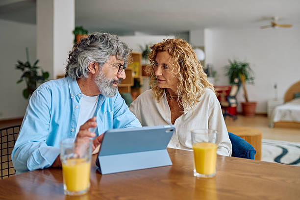 istock Senior Couple Using Digital Tablet at Home 2232871132