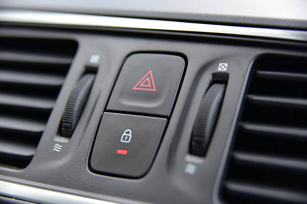 A switch for the hazard lights in the car