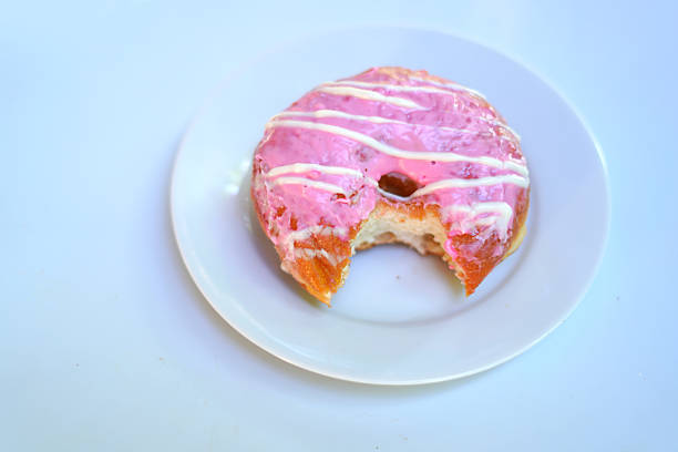Bite-Sized Donut on White Plate – Delicious Mini Treats.