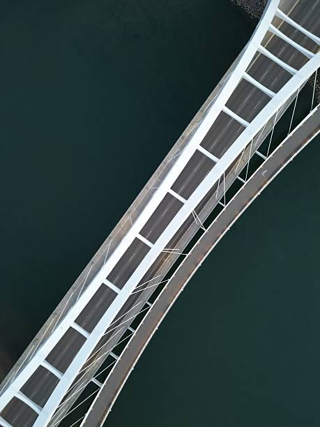 istock White bridge against a blue river in drone photography. Edmonton 2232879343