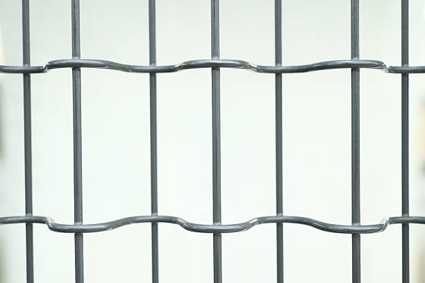 istock Close-up of the mesh fence. 2232879759