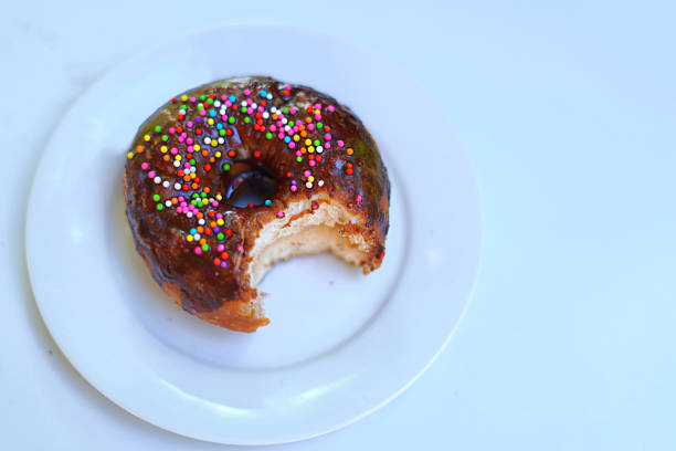 Freshly Baked Bite Donut Served on White Plate.