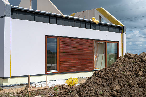 istock Modern modular house under construction - front view with wooden facade and large windows. 2232893325