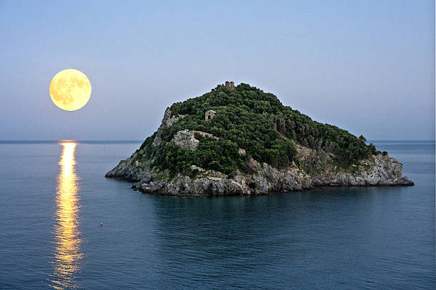 istock Bergeggi Island with full moon 2232894726