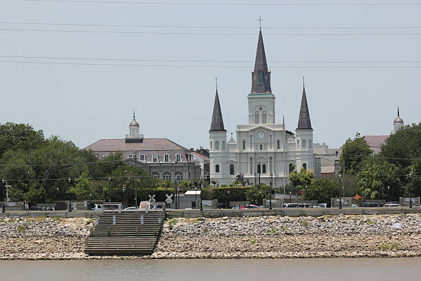 New Orleans, Louisiana, USA. Taken May 29, 2012.  - View of the St. Paul's Cathedral from the Mississippi river in the French Quarter, which is the city’s historic heart, famous for its vibrant nightlife and colorful buildings with cast-iron balconies. Crowd-pleasing Bourbon Street features jazz clubs, Cajun eateries and raucous bars serving potent cocktails. Quieter streets lead to the French Market, with gourmet food and local crafts, and to Jackson Square where street performers entertain in front of soaring St. Louis Cathedral.