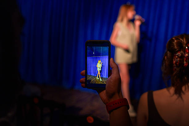 istock Audience member recording stage performance with smartphone 2232899231