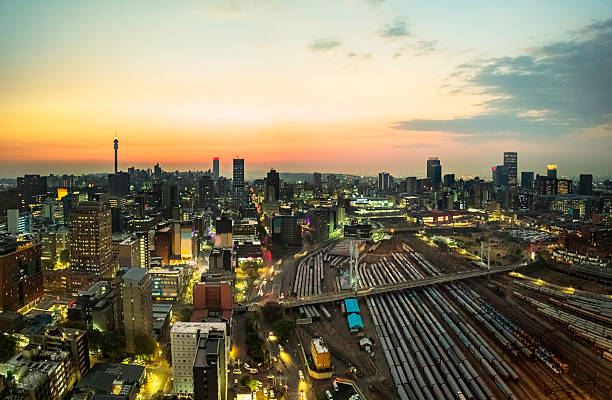Nelson Mandela Bridge in the evening towards sunrise in Johannesburg, over the Railway Junction. Johannesburg is also known as Jozi, Jo'burg or eGoli, is the largest city in South Africa.