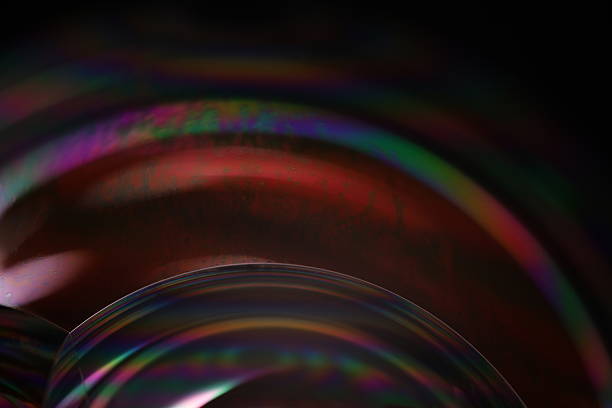 istock Rainbow liquid film effect, colourful reflection of the liquid, scientific abstraction 2232904697