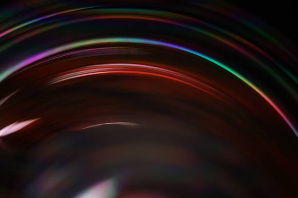 istock Multicoloured liquid line on dark background, reflections of liquid in macro 2232904699