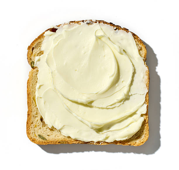 istock toasted bread slice with cream cheese isolated on white background, top view 2232905027