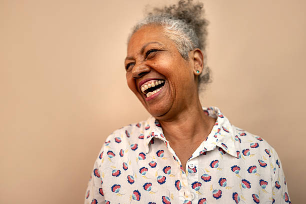 istock Senior woman laughing in a studio shot 2232907261
