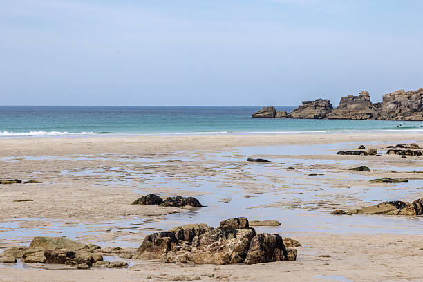 istock Low tide at Sennen beach in Cornwall, with a blue sky overhead 2232909964