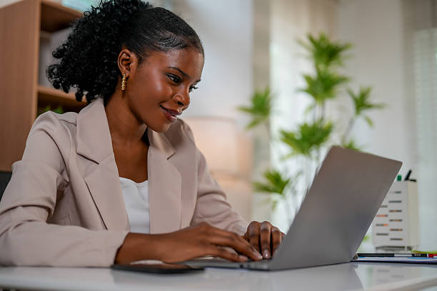 istock Woman engages in creative collaboration using technology while working on laptop in modern office environment. connection between her ideas and digital world is evident 2232914641