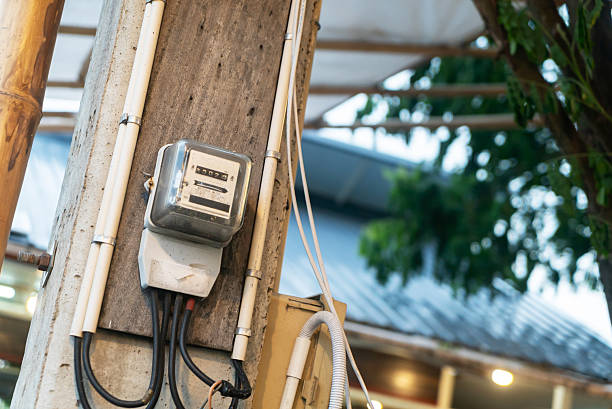istock Metal Electric Meter on Concrete Wall 2232914873