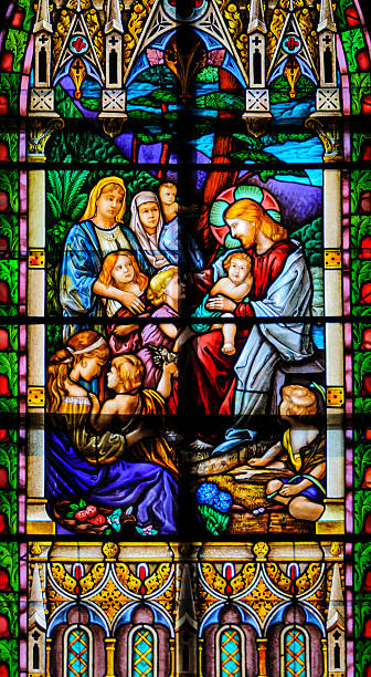 Chapel Notre Dame - Montfaucon, France - 05-04-2025: Stained glass (19th century) of Christmas Nativity Scene with Virgin Mary, Saint Joseph, and Jesus baby.
