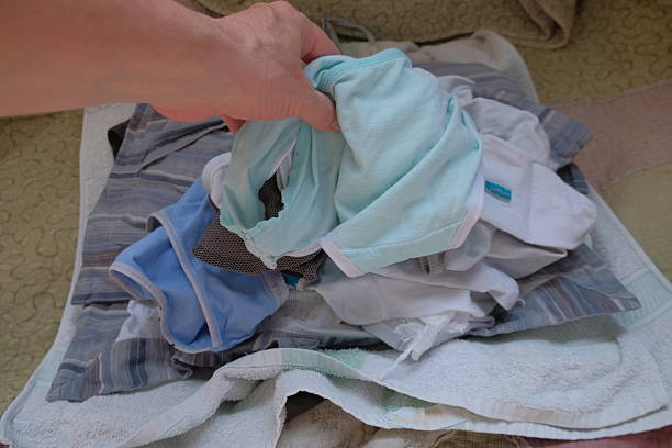 istock Various Linen After Washing and Drying A Person Holds Items Clothes 2232916381