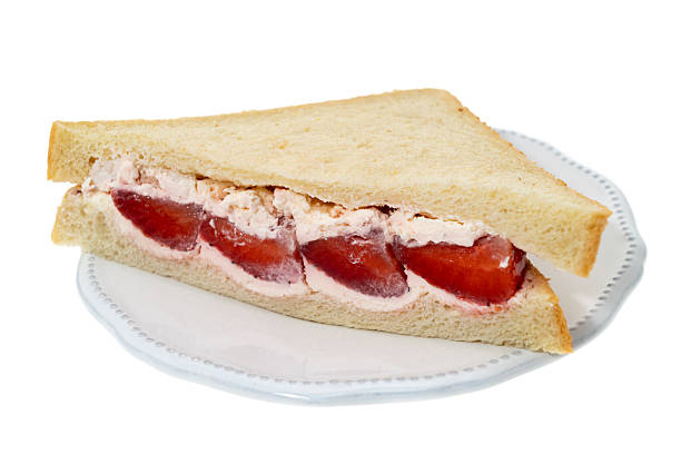 A strawberry and fresh cream sandwich - white background