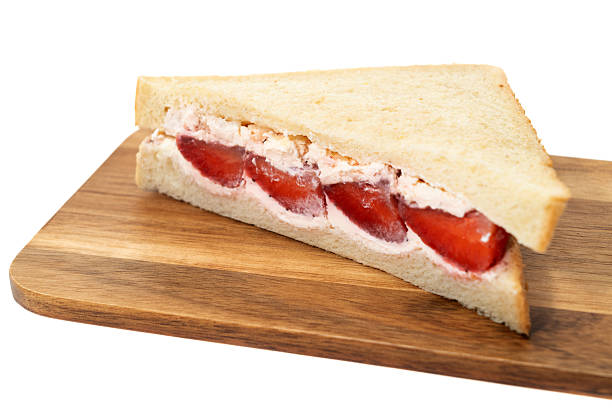 A strawberry and fresh cream sandwich - white background