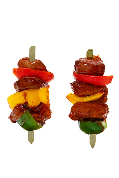istock Chicken kebab skewers - white background 2232917961