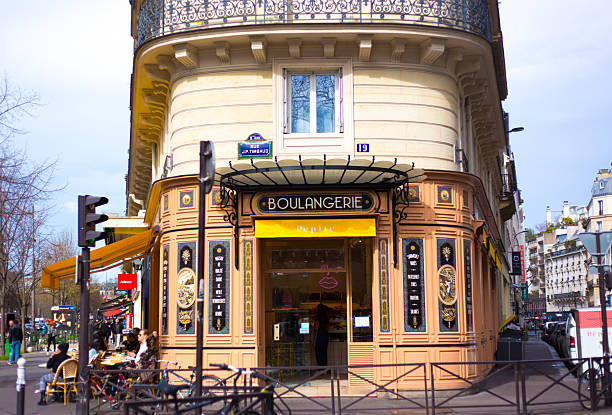 Paris, France - March 22, 2025: The charmingly retro Pepite Boulangerie Republique on Boulevard Voltaire in the 10th arrondissement, with people sitting at sidewalk tables outside.
