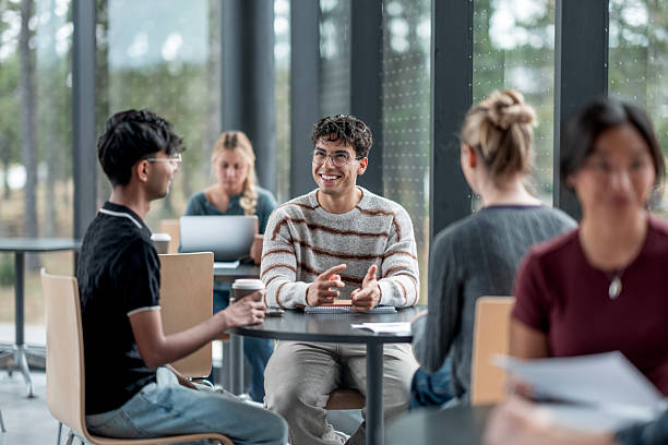 istock Group of Young Students Having a Discussion in a Modern Study Area 2232927075