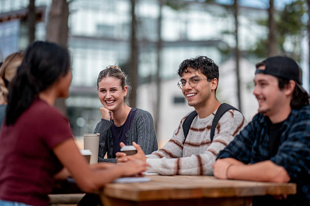 istock Group of Students Socializing Outdoors on a Campus in a Friendly Atmosphere 2232927145