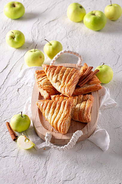 istock Delicious apple triangle cake served in sunny kitchen. 2232928884