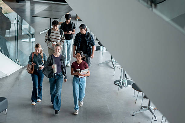 istock Group of Students Walking Together Inside a Modern University Building 2232929068