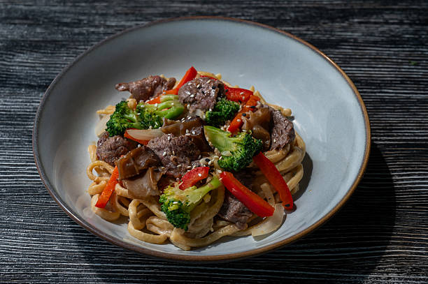 istock Top view of pasta with beef and broccoli. 2232929896