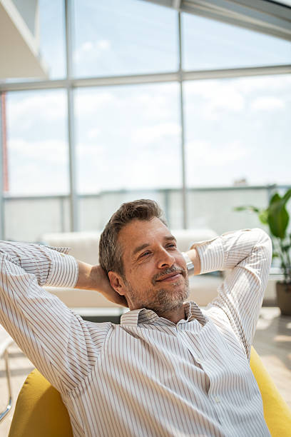 istock Relaxed business professional enjoying a break in a modern bright office setting 2232930330