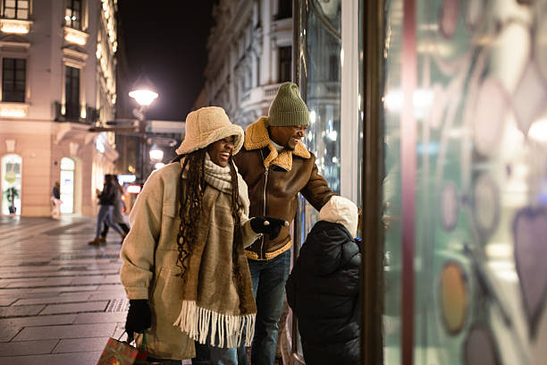 istock Family Window Shopping at Night 2232931287
