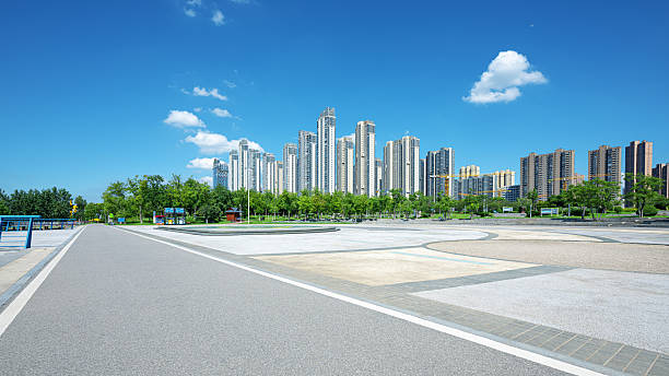 istock Empty square floor and asphalt road with modern urban skyline background 2232935280
