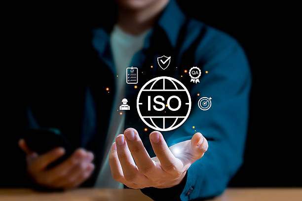 istock Quality control, certification and assurance concept according to ISO standards. Businessman using mobile phone with document and quality certification icons for ISO. 2232942580