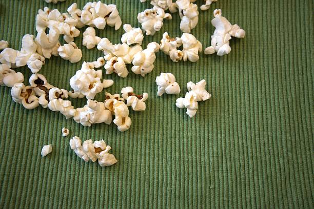 istock Popcorn on green fabric, close up, background 2232961007