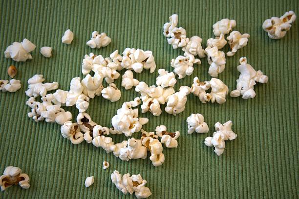 istock Popcorn on green fabric, close up, background 2232961016