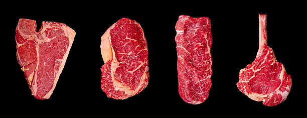 istock Different cuts of premium beef arranged on a dark background for presentation 2232962761